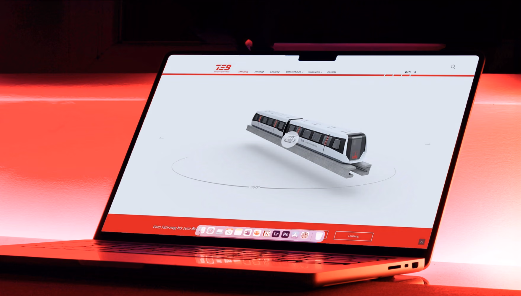A laptop on a red-lit desk shows the Transport System Boegl website with a rotatable 3D model of the maglev vehicle.