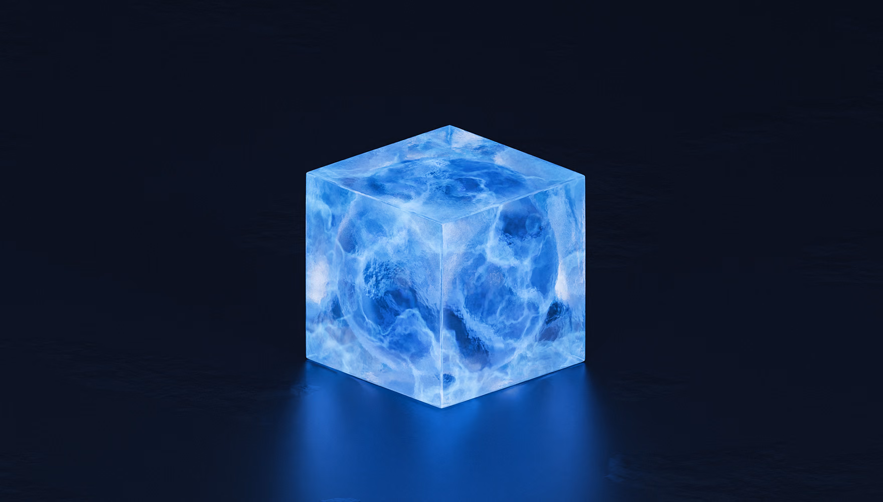 A single translucent blue cube glows on a dark reflective surface, its light spilling onto the floor in front of it.